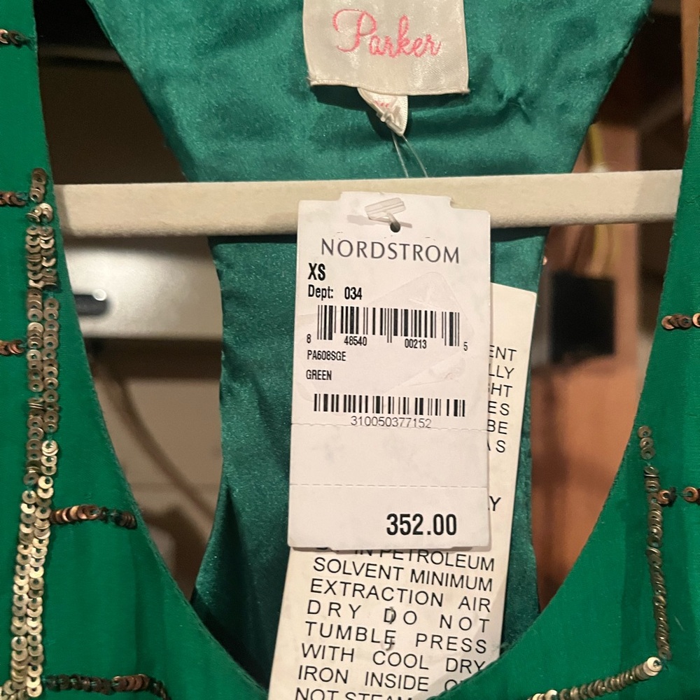 New with tags - original price $352. Beautiful emerald Green with sequence.